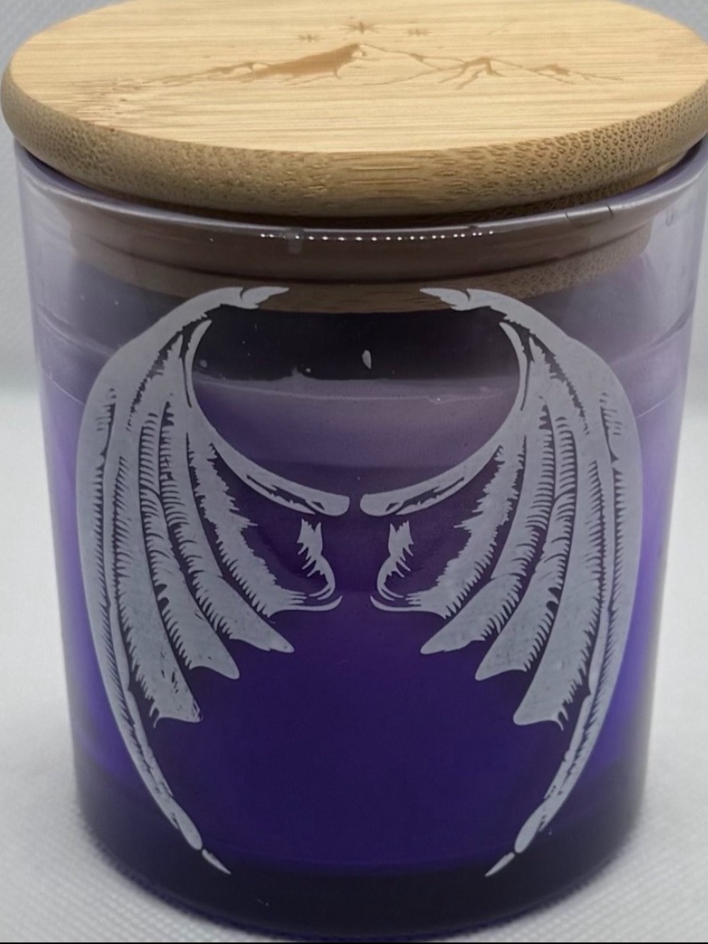 Purple Halloween Candle in Glass Container with White Batwings